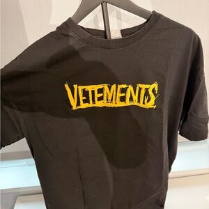 Vetements Black Tee with Vibrant Yellow World Tour Print